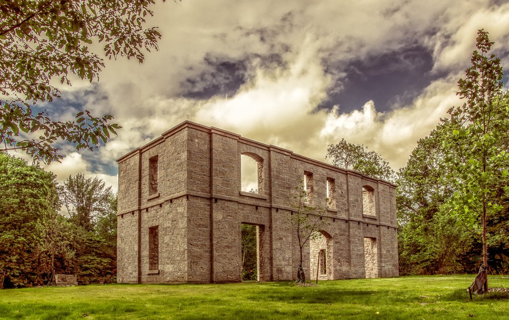 The Hermitage ruins site sits in within a spook fall background.