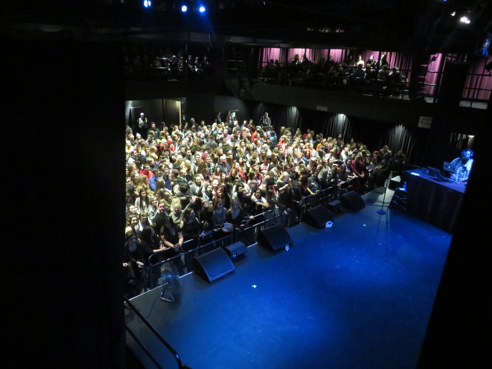 Full crowd facing the stage at The Studio before a show starts.