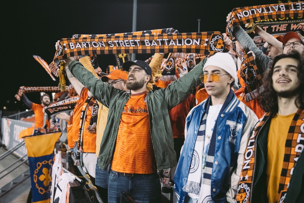 Fans cheering on Forge FC at Tim Hortons Field.