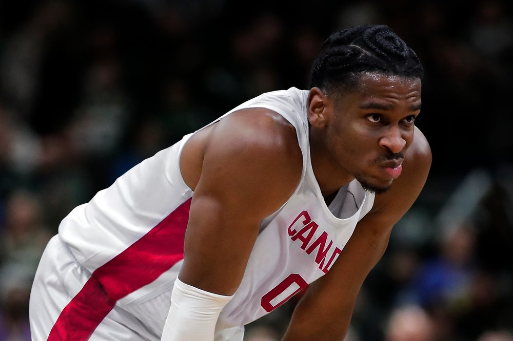 Shai Gilgeous-Alexander playing for Team Canada on court during a game.