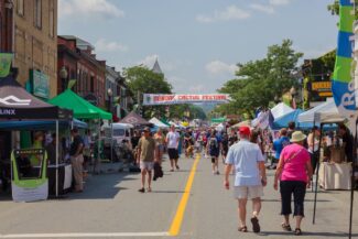 Downtown Dundas with lined streets filled with people and vendors.