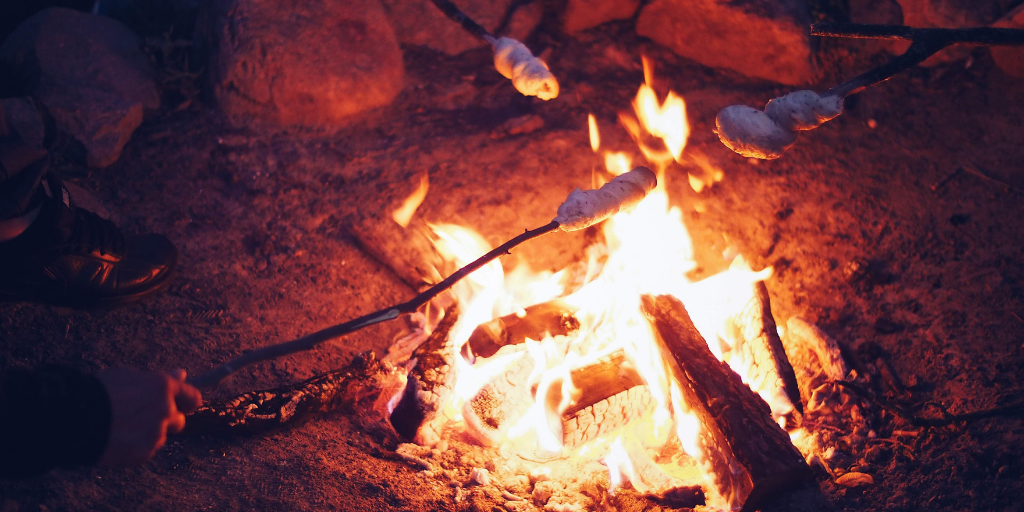 Marshmallows roasting over campfire