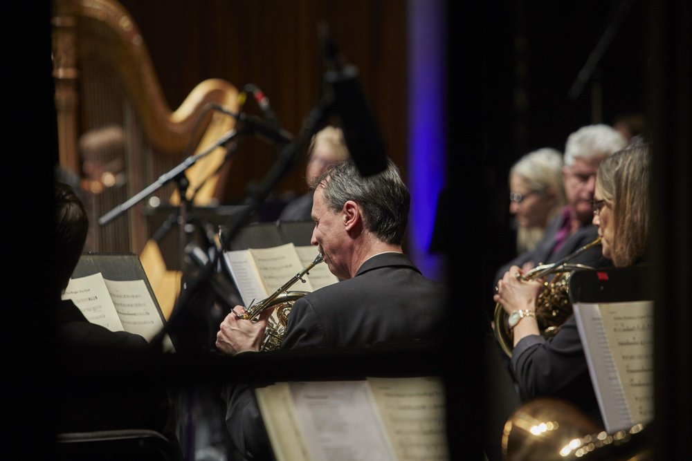 HPO on stage performing.