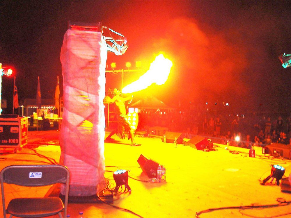 Fire eater entertaining crowd