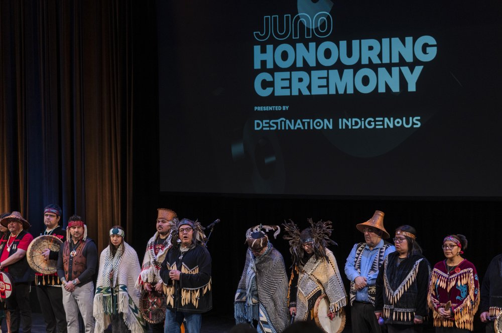 Indigenous artists on stage.