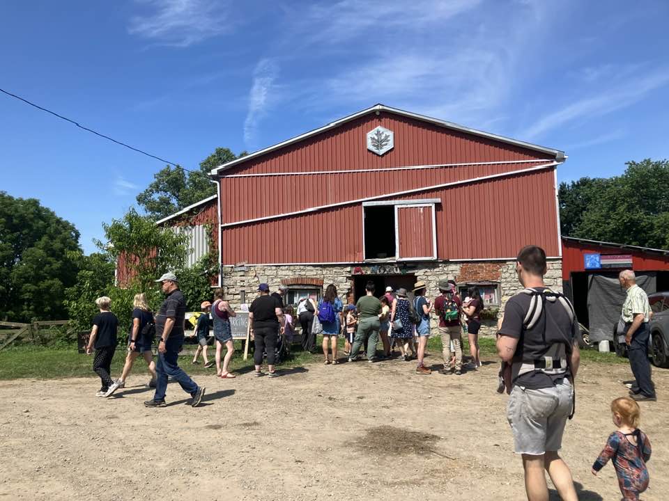 A group standing in front of the barn at Manorun Farms.