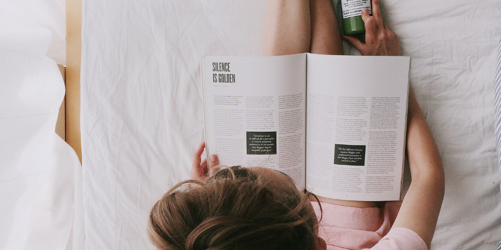 Guest reading on bed