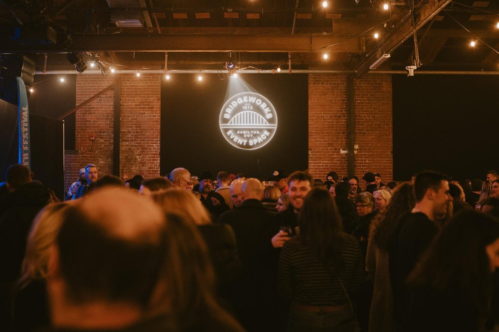 Crowd at bridgeworks facing the stage