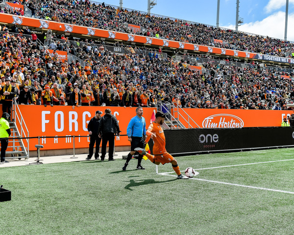 Forge FC player taking a corner kick.