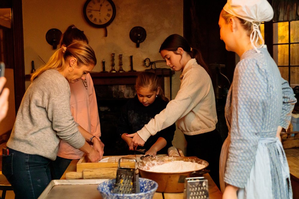 Group cooking in historic kitchen in Dundurn Castle.