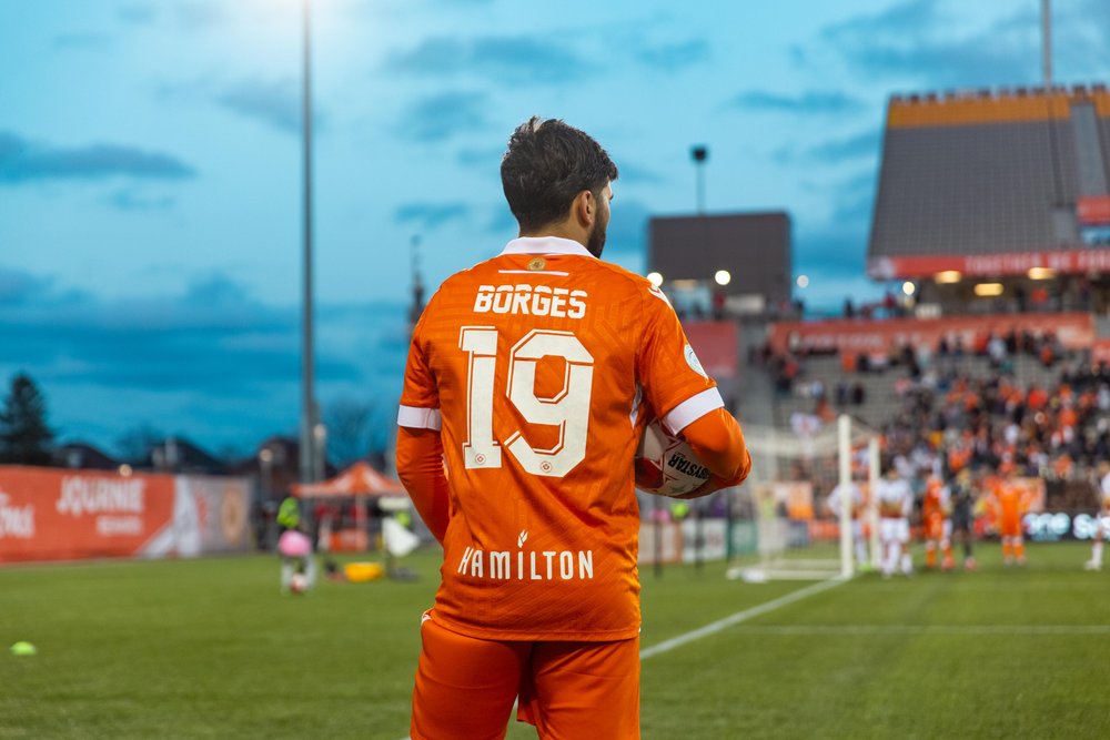 Forge FC player on field.