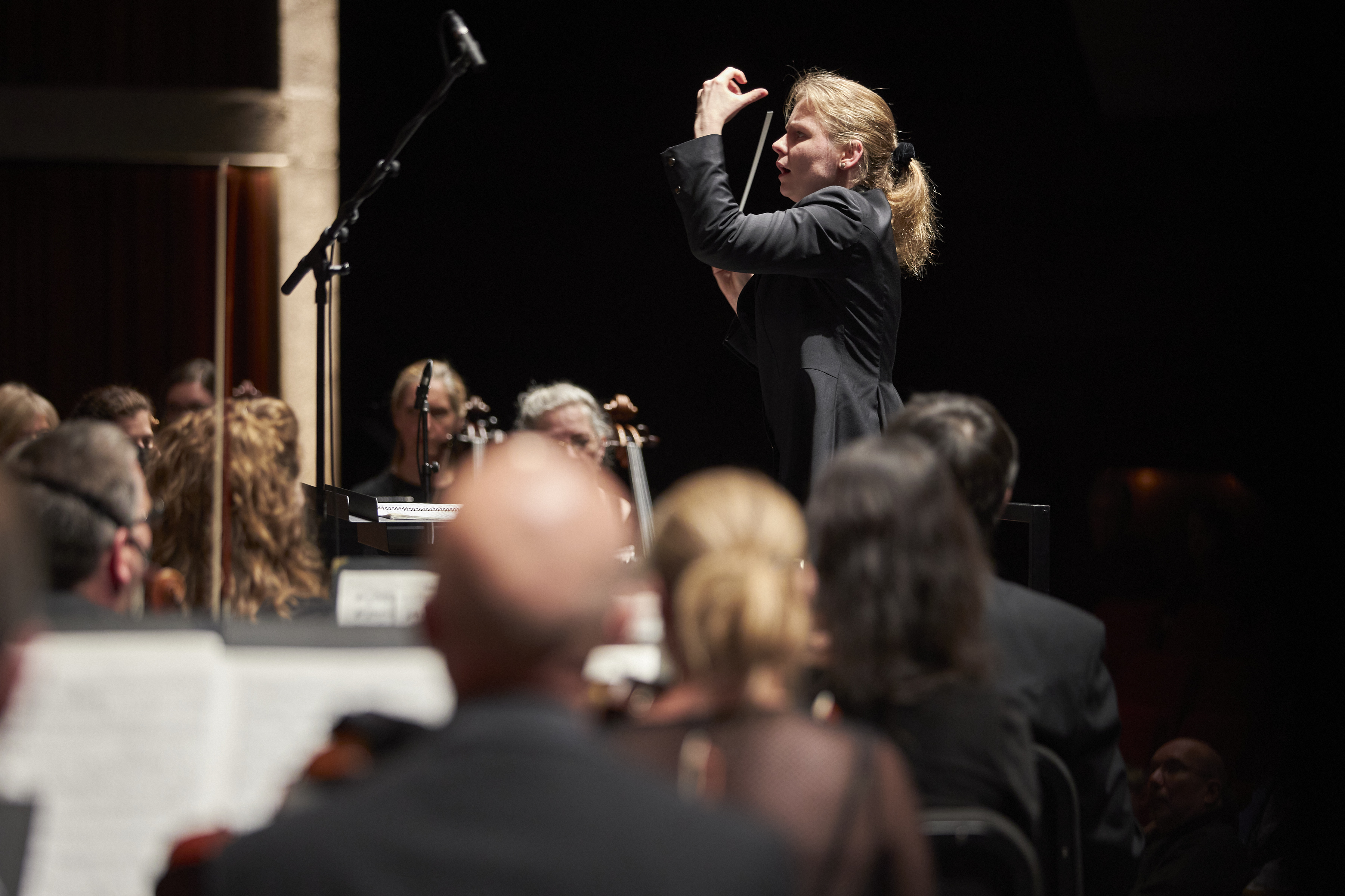 HPO conductor leading orchestra.