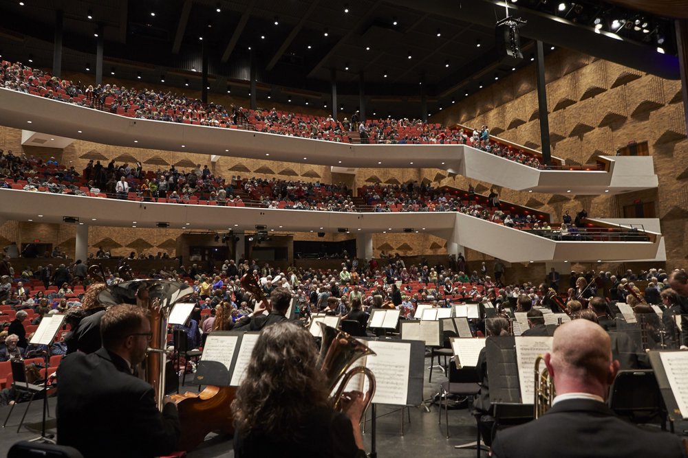 HPO on stage looking out at audience.