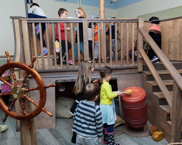 Children playing inside museum