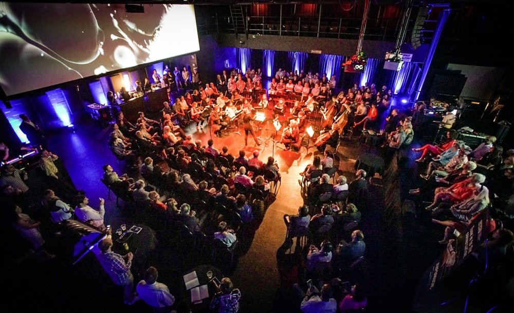 View of HPO musicians from above as they perform in a community location.