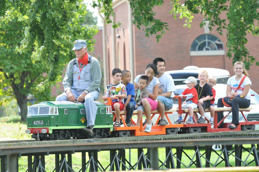 Families riding mini steam trains at Hamilton Museum of Steam and Technology.