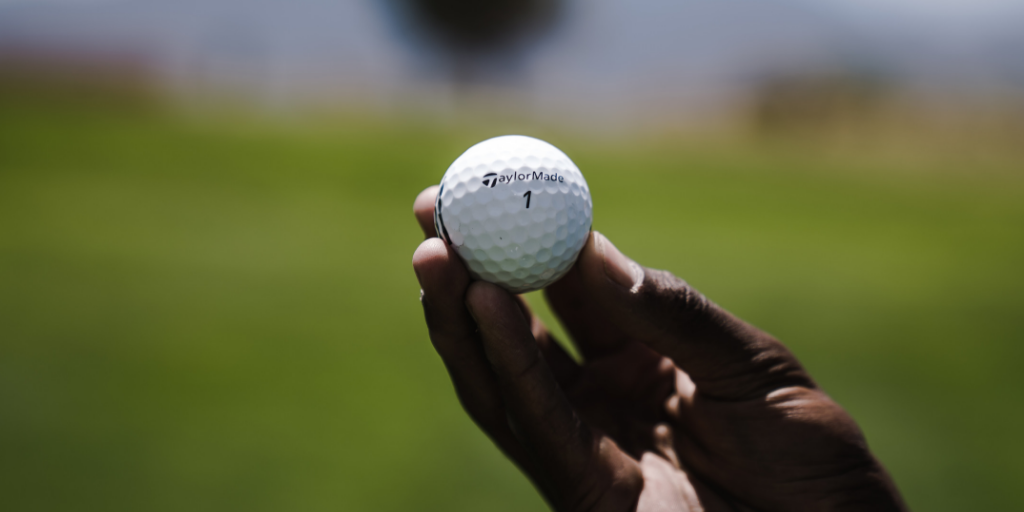 Golfer holding ball