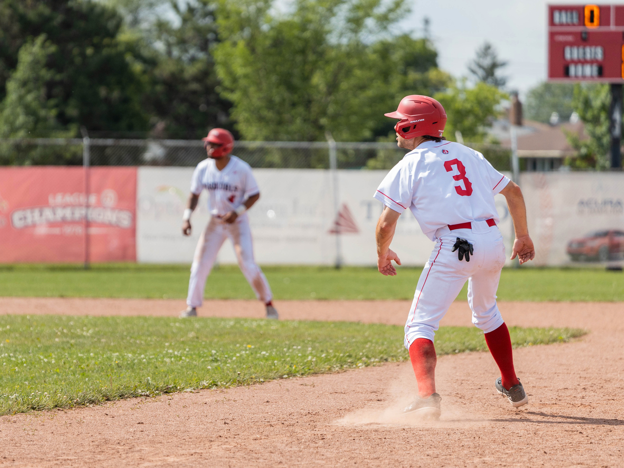 Cardinals players running bases.