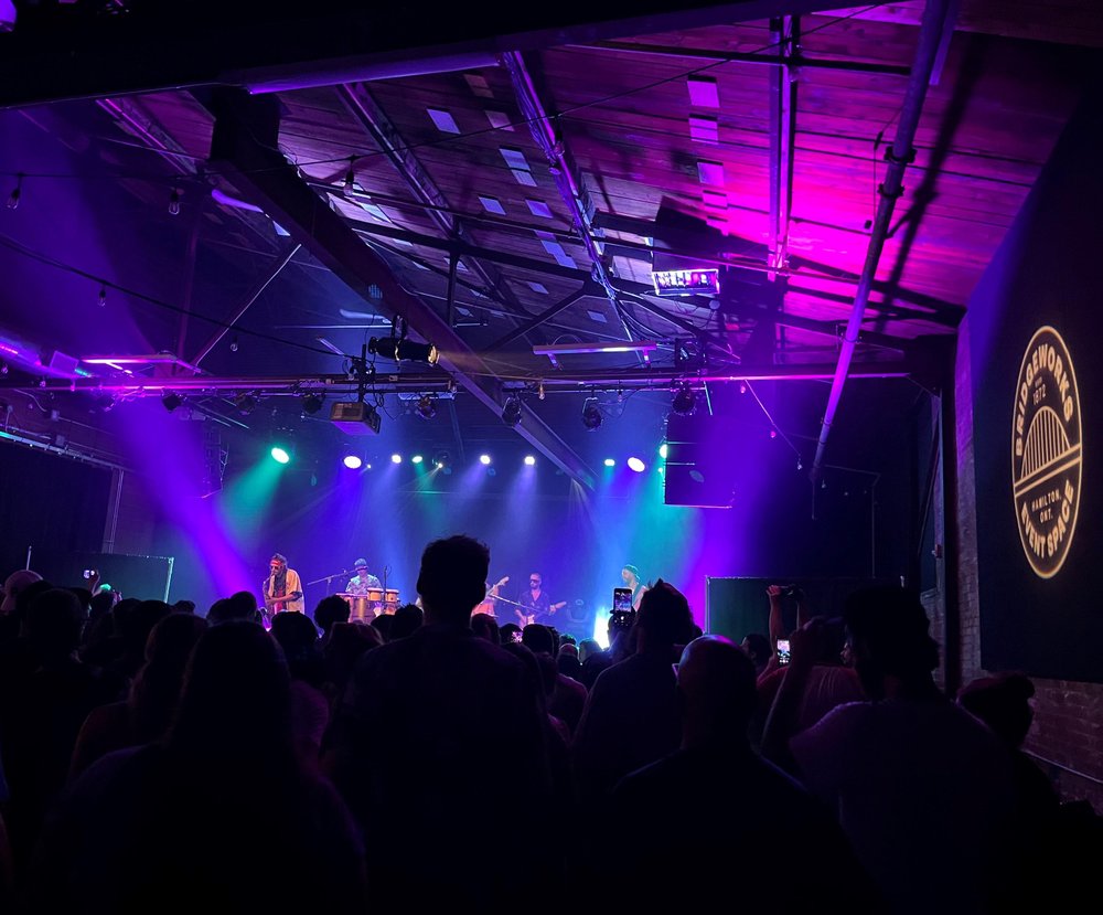 Full lights on stage with full crowd during show at Bridgeworks.