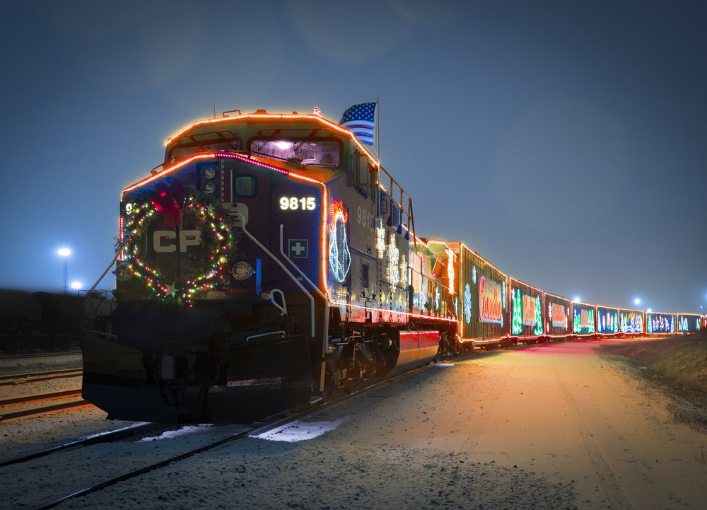 CP Holiday Train on route with festive holiday lights.