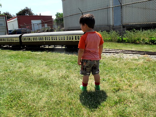 Kid looking at train