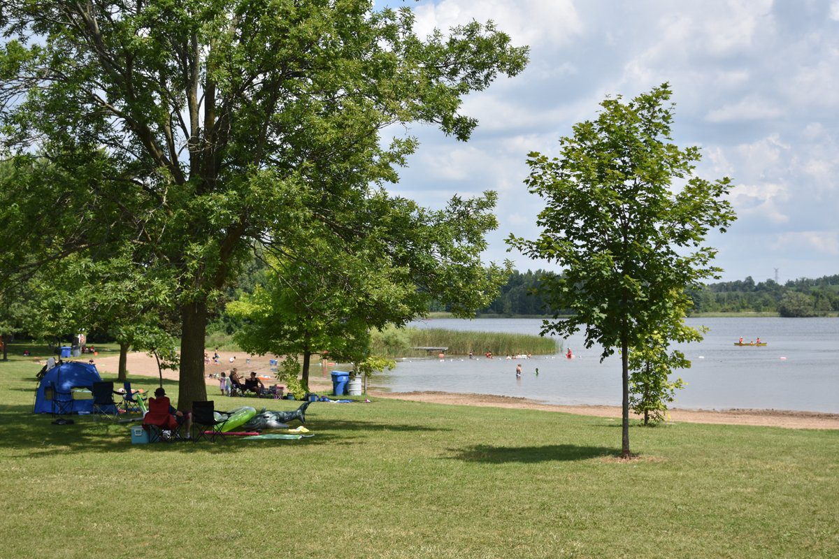 Valens Lake beachfront with visitors swimming