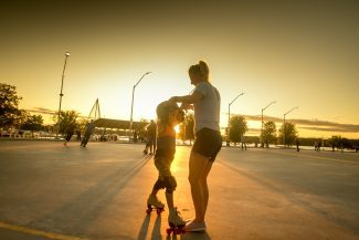 Mom and daughter dancing on skates at bayfront