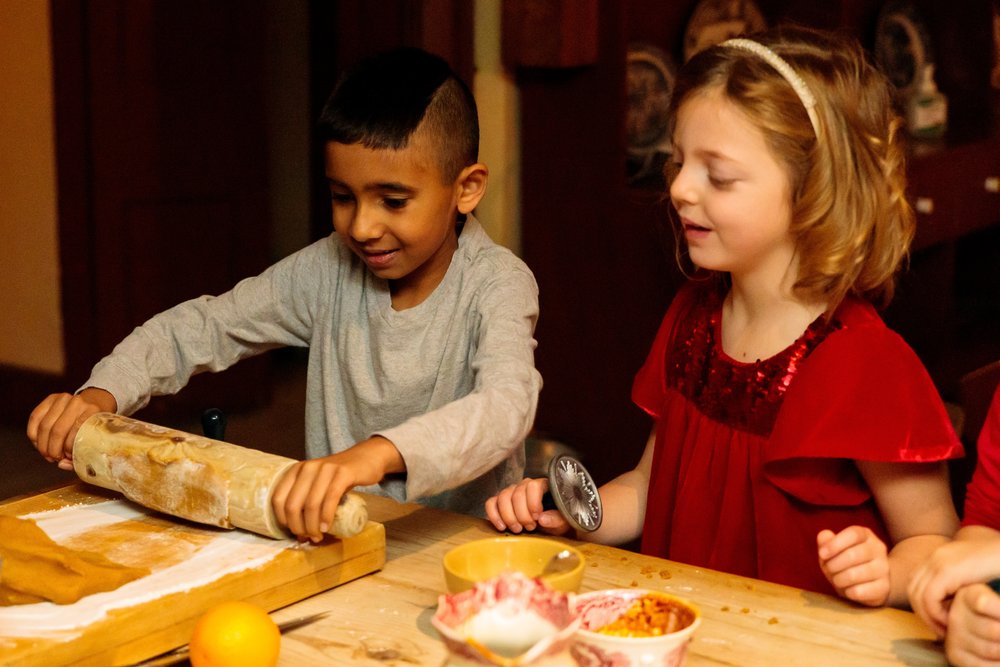 Children baking in the historic kitchen at Dundurn Castle.