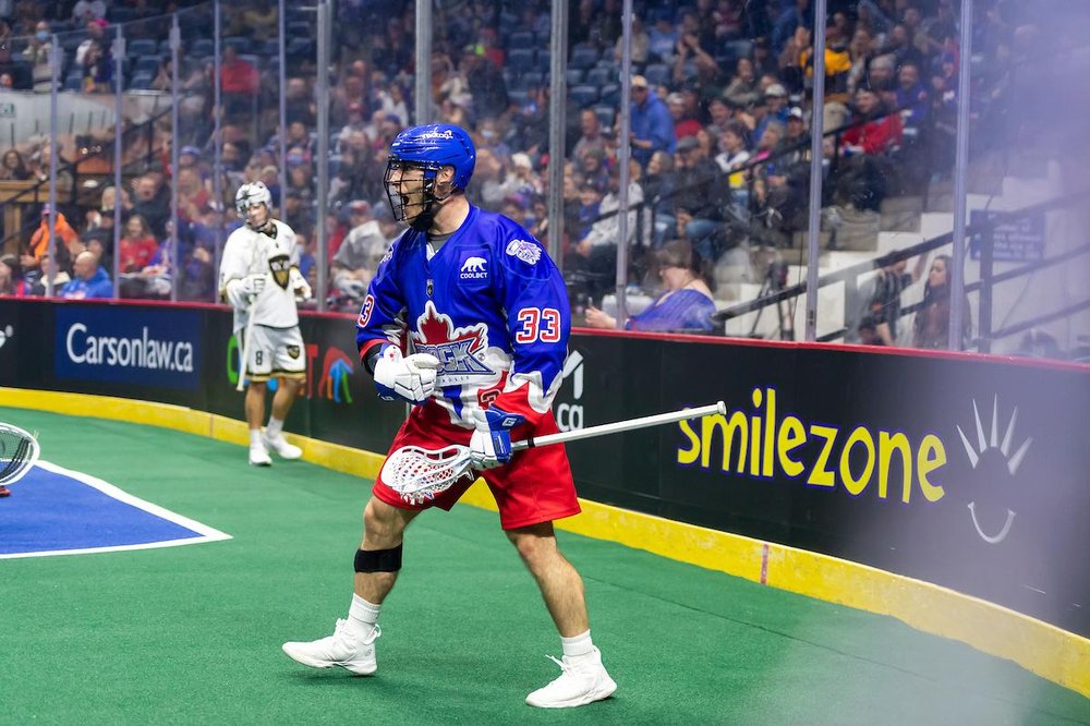 Rock player cheering on field after a goal.