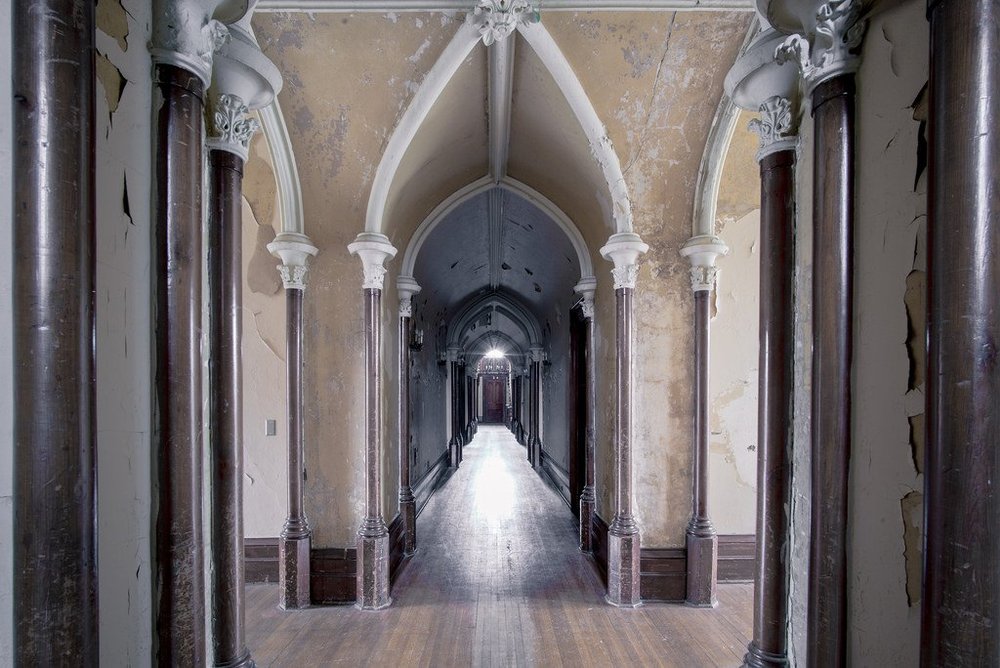 Long hallway with gothic architecture inside Auchmar House.