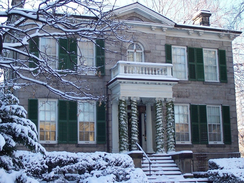 Snow covered exterior of Whitehern Historic House & Garden.